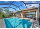 Inviting screened pool area with ample seating and lake view at 5341 Popoli Way, Sarasota, FL 34238
