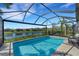 Relaxing screened pool and spa with picturesque lake views at 5341 Popoli Way, Sarasota, FL 34238