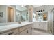 Double vanity bathroom with modern finishes at 5436 Hope Sound Cir, Sarasota, FL 34238