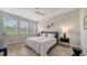Bright bedroom with a comfortable bed and large windows at 5436 Hope Sound Cir, Sarasota, FL 34238