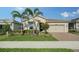 One-story home with attractive landscaping and a two-car garage at 5436 Hope Sound Cir, Sarasota, FL 34238