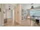Bright home office features built-in shelving and wood-look tile flooring at 5436 Hope Sound Cir, Sarasota, FL 34238