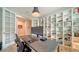 Home office features a large desk, built-in shelving, and a window at 5436 Hope Sound Cir, Sarasota, FL 34238