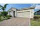 Tan two-story house with a paved driveway at 5436 Hope Sound Cir, Sarasota, FL 34238