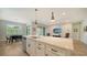 Open concept kitchen with island and breakfast bar seating at 5436 Hope Sound Cir, Sarasota, FL 34238