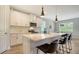 Sleek kitchen featuring white cabinets and a large island at 5436 Hope Sound Cir, Sarasota, FL 34238