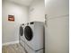 Convenient laundry room with washer, dryer, and ample storage at 5436 Hope Sound Cir, Sarasota, FL 34238