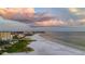 Aerial view of beach and coastline with sunset at 5968 Midnight Pass Rd # 164, Sarasota, FL 34242