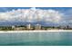 Beachfront view of condo buildings and ocean at 5968 Midnight Pass Rd # 164, Sarasota, FL 34242