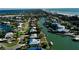 Breathtaking aerial view of a charming waterfront community and canals close to the beach at 6011 Emerald Harbor Dr, Longboat Key, FL 34228