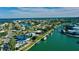 Beautiful aerial view of a waterfront community with canals leading to the bay at 6011 Emerald Harbor Dr, Longboat Key, FL 34228