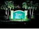 Night view of Tara Golf & Country Club private entrance sign at 6501 Stone River Rd # 203, Bradenton, FL 34203