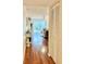 Inviting entryway with hardwood floors and views into the living area at 6501 Stone River Rd # 203, Bradenton, FL 34203