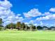 Scenic golf course view with lake and lush green fairways at 6501 Stone River Rd # 203, Bradenton, FL 34203