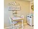Charming kitchen nook with white table and chairs at 6501 Stone River Rd # 203, Bradenton, FL 34203