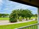 View of golf course from screened lanai at 6501 Stone River Rd # 203, Bradenton, FL 34203