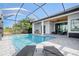 Enjoy this gorgeous pool and spa with covered lanai at 8 Idle Ct, Placida, FL 33946