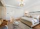 Main bedroom with sitting area and large windows overlooking the water at 8436 Cane Bay Ct, Lakewood Ranch, FL 34202