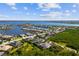 Aerial view of a waterfront neighborhood featuring waterfront homes and lush surroundings at 942 Preservation St, Bradenton, FL 34208