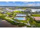 Scenic aerial view showcasing the pool, playground, and surrounding community at 942 Preservation St, Bradenton, FL 34208
