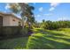 Beautiful backyard with healthy lawn and landscaping around the house at 942 Preservation St, Bradenton, FL 34208