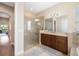 Elegant bathroom with a glass shower, tile surround, and a vanity with granite counters at 942 Preservation St, Bradenton, FL 34208