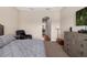 Comfortable bedroom featuring carpeted floors, neutral walls, and relaxing decor at 942 Preservation St, Bradenton, FL 34208