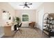 Office/bedroom featuring a ceiling fan, closet, and hardwood floors, offering a space to work at 942 Preservation St, Bradenton, FL 34208