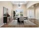 Formal dining room featuring hardwood floors, high ceilings, and neutral decor with a modern light fixture at 942 Preservation St, Bradenton, FL 34208