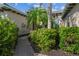 Front walkway with lush foliage and flowers leading to the front door at 942 Preservation St, Bradenton, FL 34208