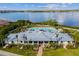 Aerial view of the community center with a pool and seating area by the water at 942 Preservation St, Bradenton, FL 34208