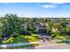 Well-maintained home with lush landscaping, charming curb appeal and brick-paved driveway at 942 Preservation St, Bradenton, FL 34208