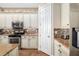 Kitchen with stainless steel microwave and oven, gorgeous countertops, and white cabinetry at 942 Preservation St, Bradenton, FL 34208