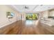 Bright living room with hardwood floors and access to a backyard view at 942 Preservation St, Bradenton, FL 34208