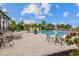Community pool with comfortable lounge chairs and well-kept landscaping at 942 Preservation St, Bradenton, FL 34208