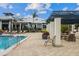 Community pool with ample seating, lounge chairs and outdoor grilling, ideal for relaxation and entertainment at 942 Preservation St, Bradenton, FL 34208
