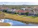 Property showcasing a home with pool and lanai, overlooking a tranquil lake at 963 River Wind Cir, Bradenton, FL 34212
