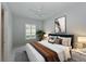 Comfortable bedroom with a plush bed, shuttered window, and stylish decor at 963 River Wind Cir, Bradenton, FL 34212