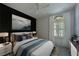 Guest bedroom with a full-size bed and stylish decor at 963 River Wind Cir, Bradenton, FL 34212