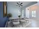 Charming dining room with lots of natural light and modern table with seating at 963 River Wind Cir, Bradenton, FL 34212