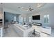 Bright and airy living room with a large window view, recessed lighting, and an elegant ceiling design at 963 River Wind Cir, Bradenton, FL 34212