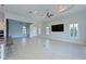 Bright living room features tile flooring, ceiling fan, and an elegant ceiling design at 963 River Wind Cir, Bradenton, FL 34212
