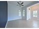 Bright living room features tile flooring, ceiling fan, lots of natural light at 963 River Wind Cir, Bradenton, FL 34212