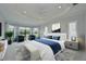 Spacious main bedroom featuring a tray ceiling, bay window, sitting area, and plush carpeting at 963 River Wind Cir, Bradenton, FL 34212