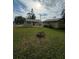 Large backyard with a fire pit and detached garage at 4706 3Rd W Ave, Bradenton, FL 34209