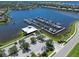 Aerial view of marina with many boats and clubhouse at 1010 Tidewater Shores Loop # 103, Bradenton, FL 34208