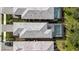 Aerial view showcasing two houses with pools and surrounding landscaping at 10358 Abaco Falls Dr, Englewood, FL 34223
