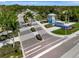 Aerial view of Beachwalk community entrance and landscaping at 10358 Abaco Falls Dr, Englewood, FL 34223