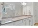 Bathroom with granite countertops and double sinks at 10358 Abaco Falls Dr, Englewood, FL 34223