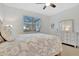 Bedroom with queen bed, nightstands and dresser at 10358 Abaco Falls Dr, Englewood, FL 34223